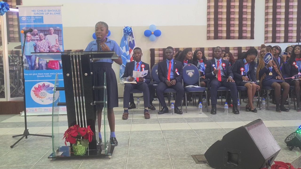10-Year-old Carol**earns praises and scholarship for assiduously introducing the guest speaker of the 15th graduating class of Hermann Gmeiner International School in Liberia